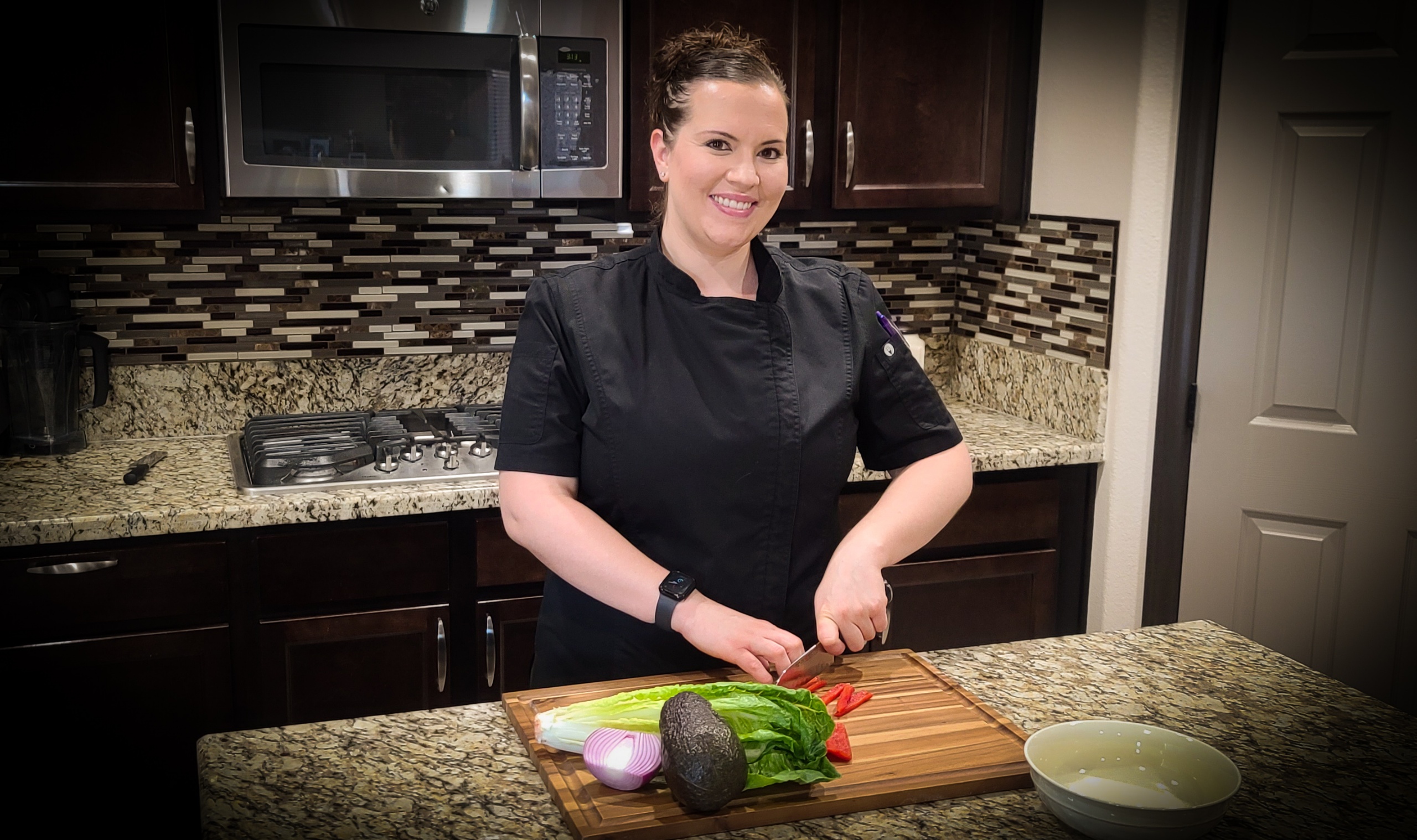 Chef Jenny Acosta preparing fresh vegetables in a private kitchen